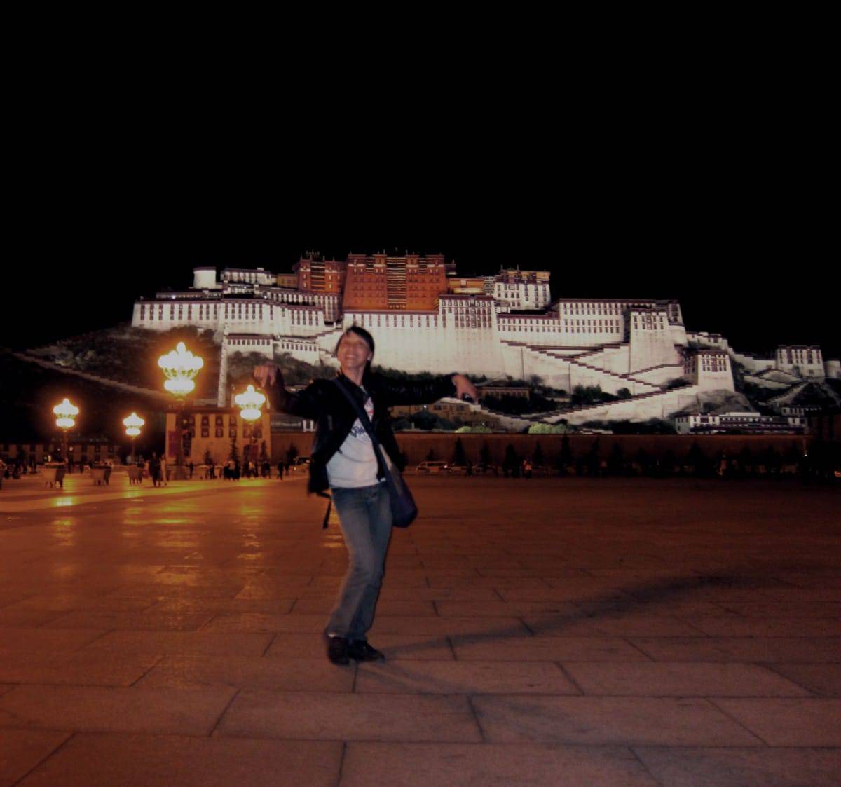 Lhamo dancing in Lhasa, in front of the Potala Palace